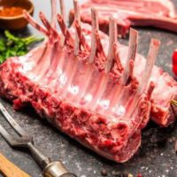 40696524 - racks of lamb ready for cooking on dark background